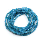Bundle of blue bead bracelet on a white background