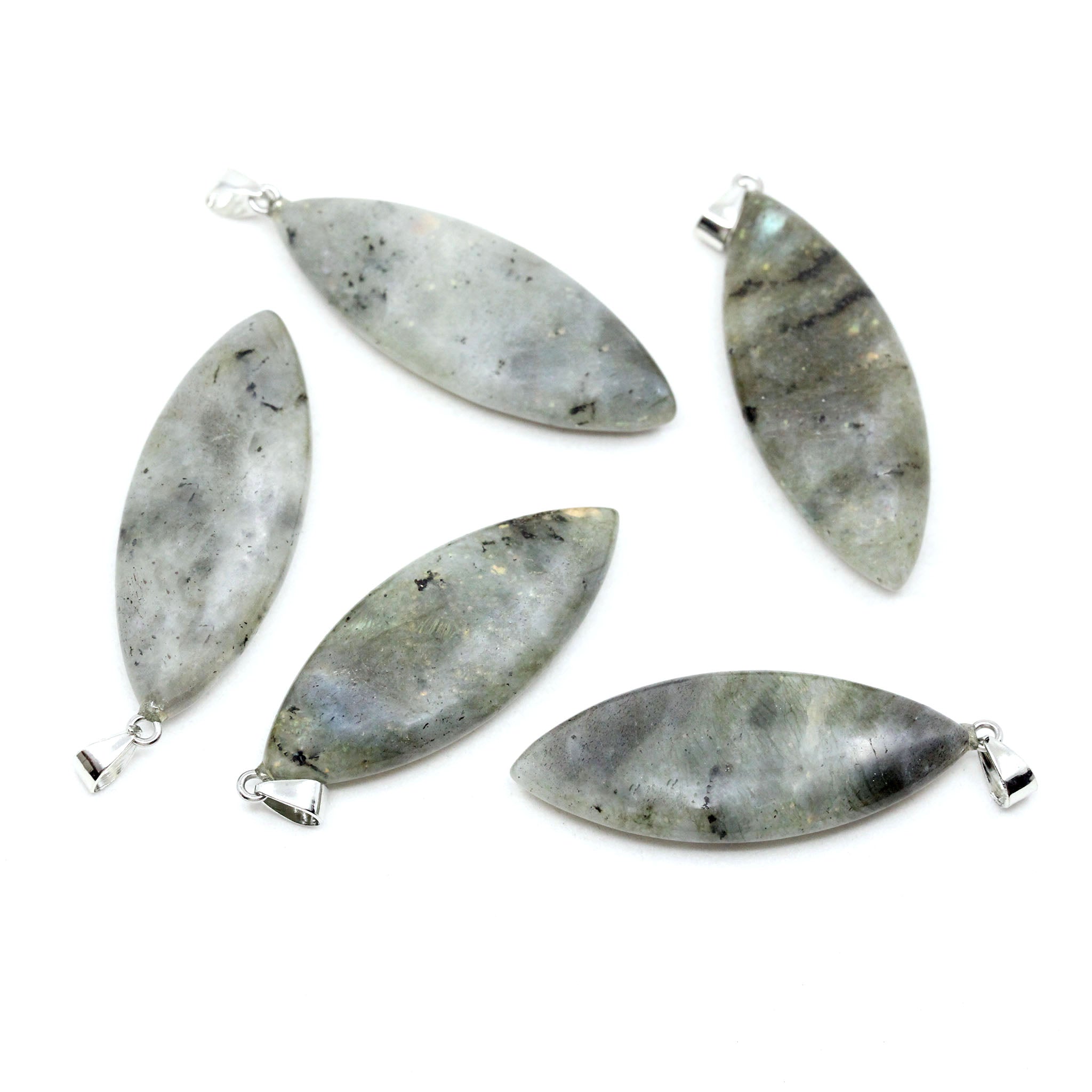 Five surfboard shaped pendants made from Labradorite on a white background